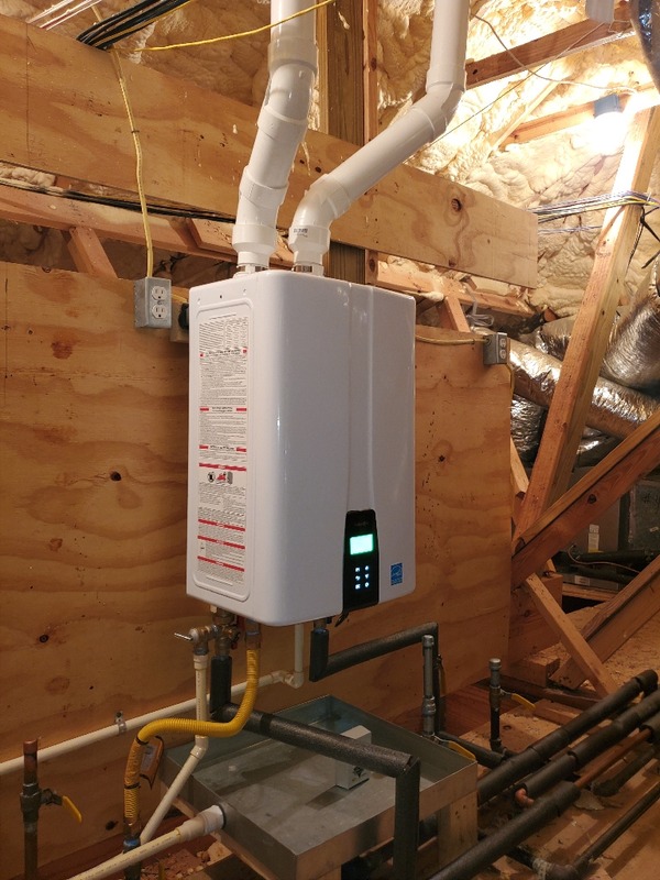 Plumber working on water lines in a home