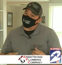 Man using a drain blaster in a white bathtub — Armstrong Plumbing on Click2Houston Test it Tuesday